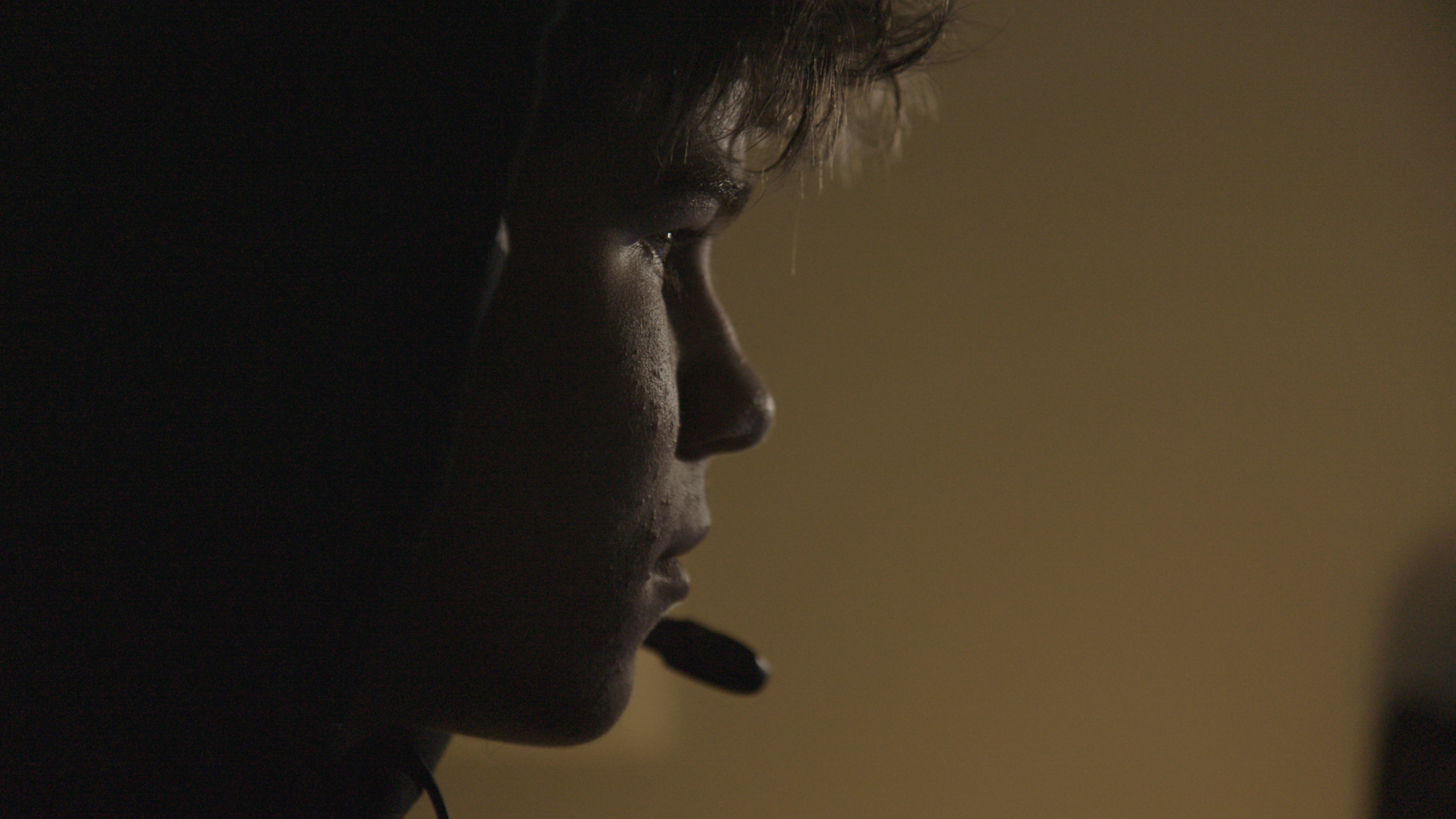 Image of a young boy with a headset on.